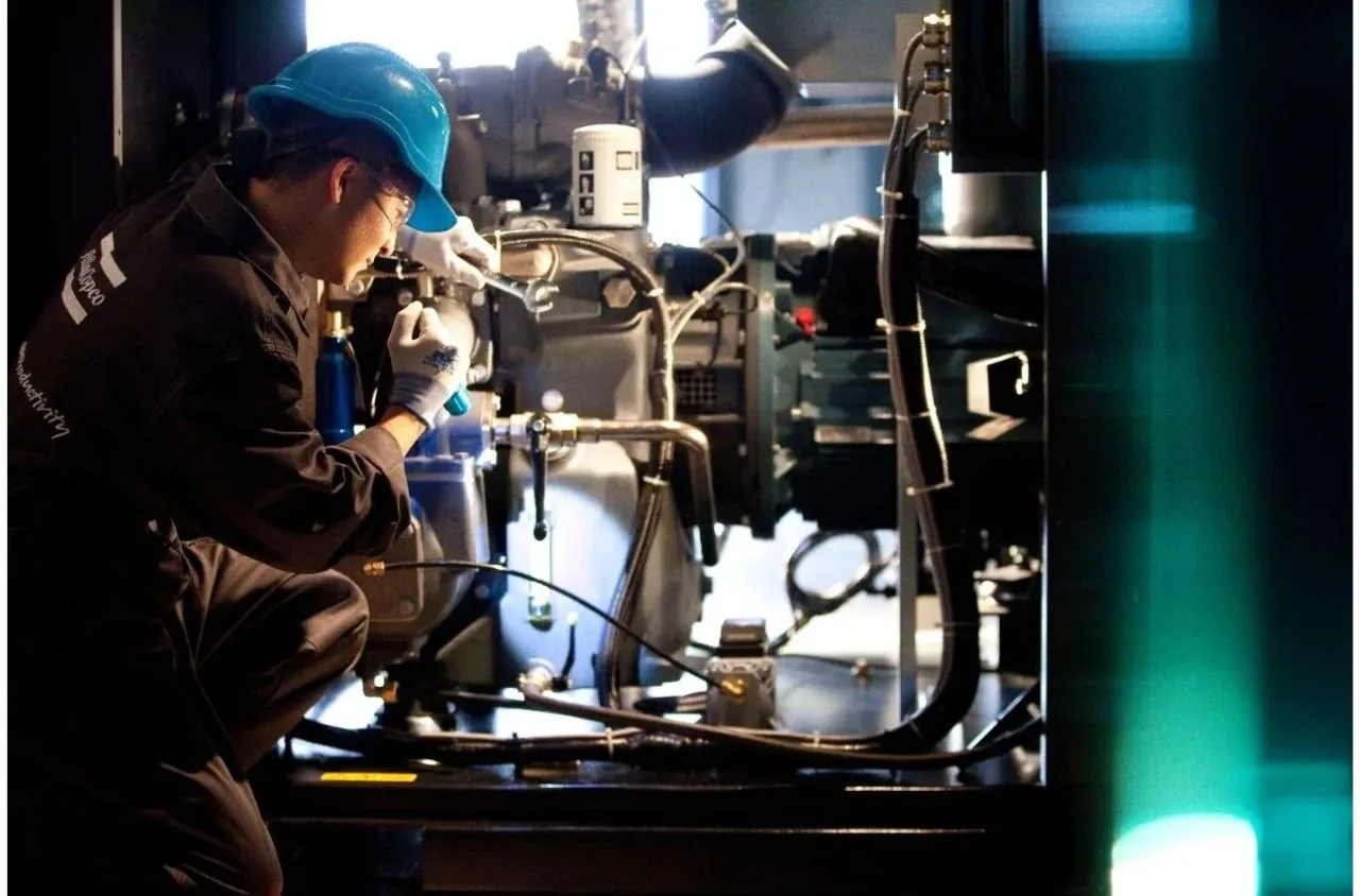Design Air engineer servicing compressed air equipment