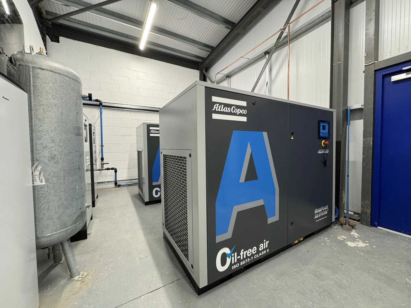 Complete Atlas Copco compressed air system installed by Design Air: oil-free compressors, air receiver and AIRnet pipework