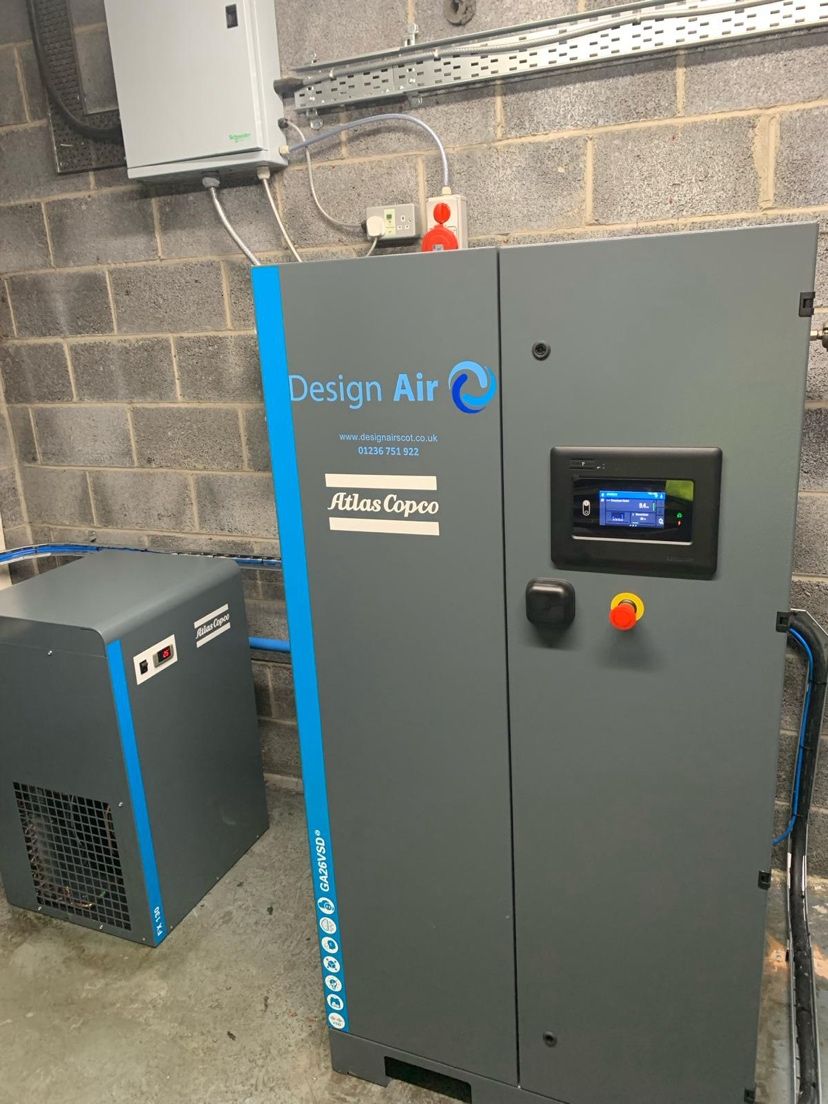 Design Air branded Atlas Copco GA26 VSD+ compressor and refrigerant dryer installed at a food and beverage site