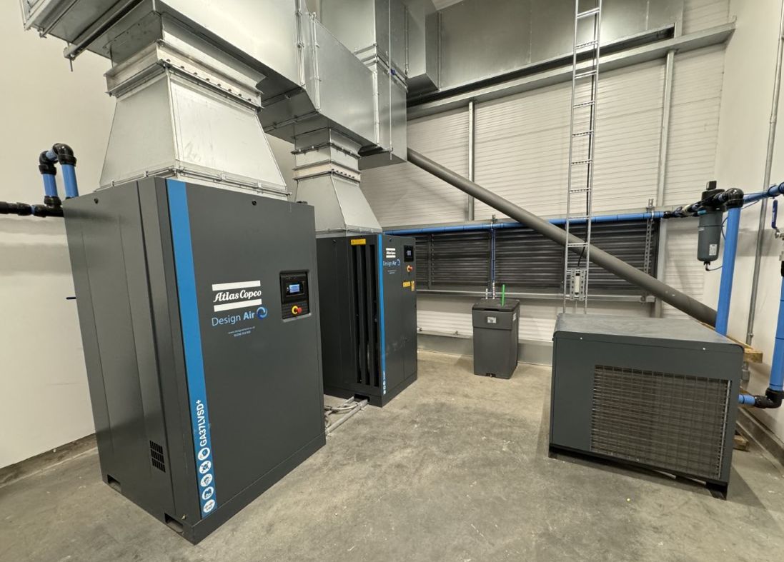 Two Atlas Copco GA37 VSD+ compressors with ducting and blue AIRnet pipework installed by Design Air