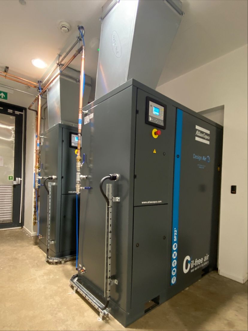 Two Atlas Copco SF22+ oil-free air compressors installed by Design Air for medical air supply